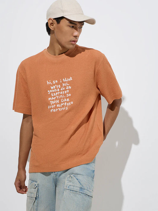 Men’s Orange Relaxed Fit Cotton T-Shirt with Text Print – Trendy Graphic Casual Top for Daily and Weekend Outfits