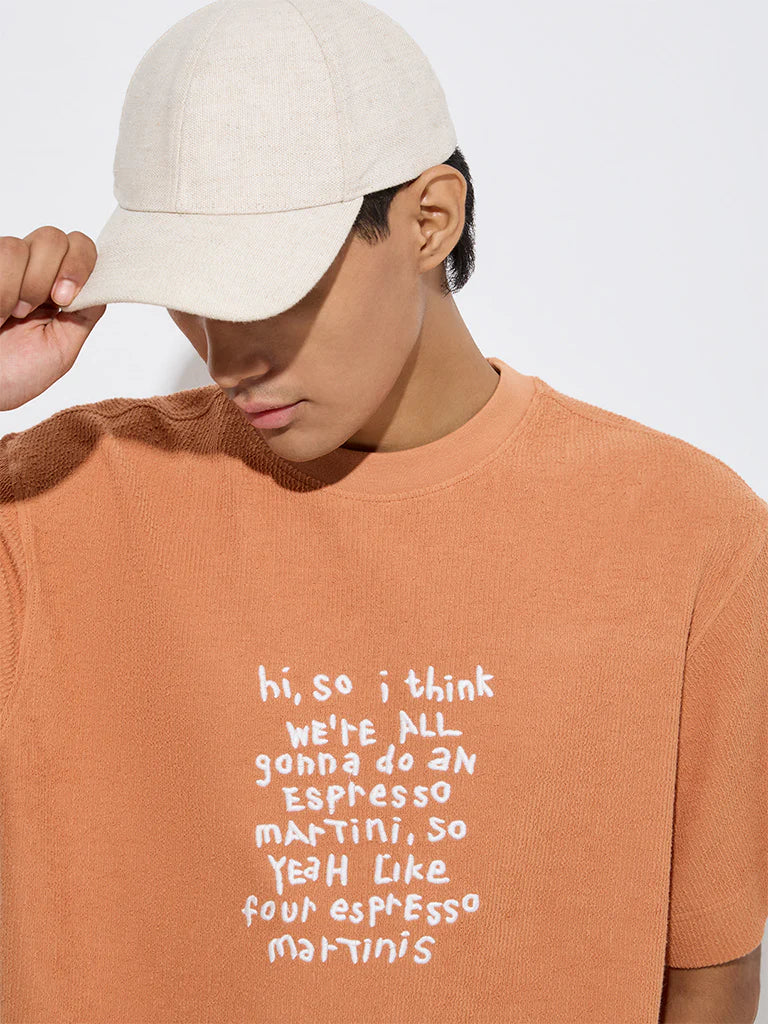 Men’s Orange Relaxed Fit Cotton T-Shirt with Text Print – Trendy Graphic Casual Top for Daily and Weekend Outfits
