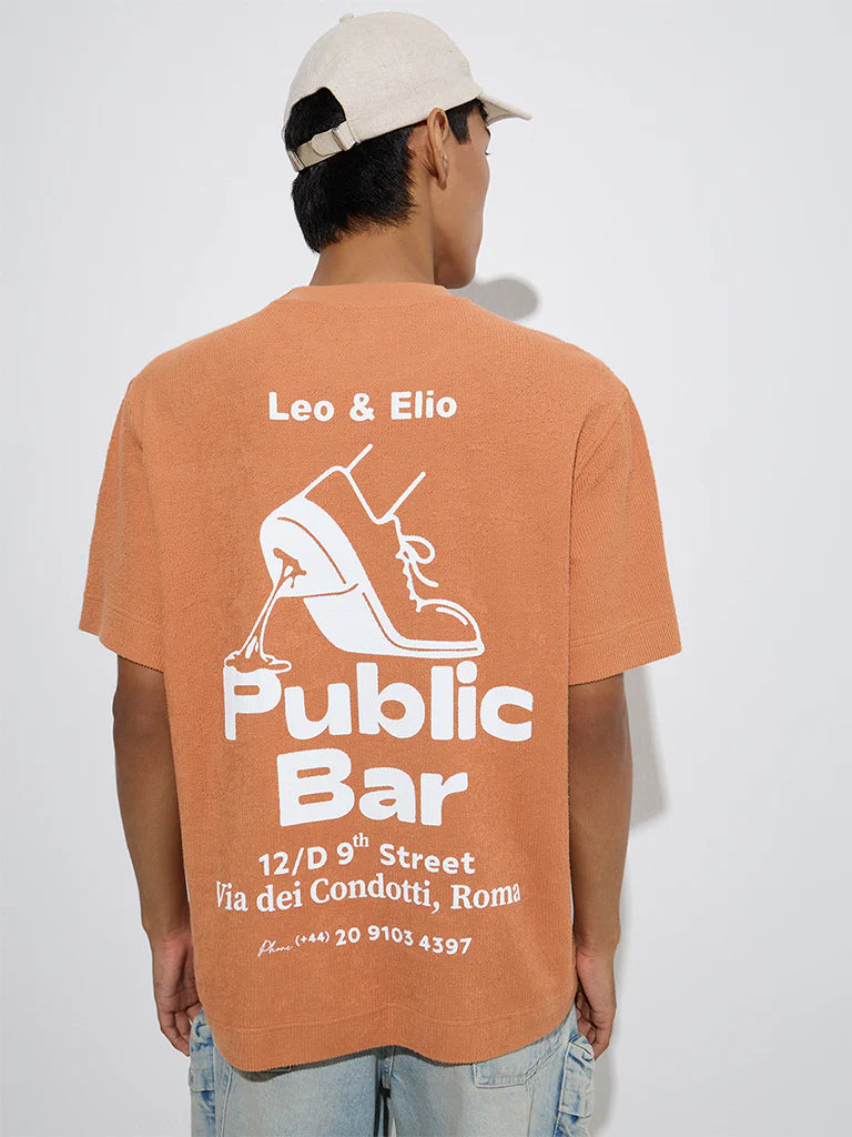 Men’s Orange Relaxed Fit Cotton T-Shirt with Text Print – Trendy Graphic Casual Top for Daily and Weekend Outfits