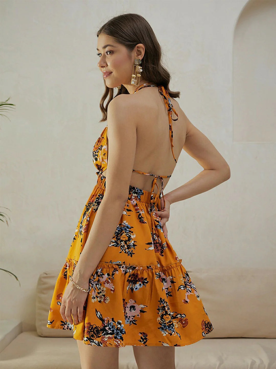 Trendy Mustard Yellow & Blue Floral Printed Sleeveless Mini Dress with Halter Neck, Back Tie-Up, and Flared Fit for Parties