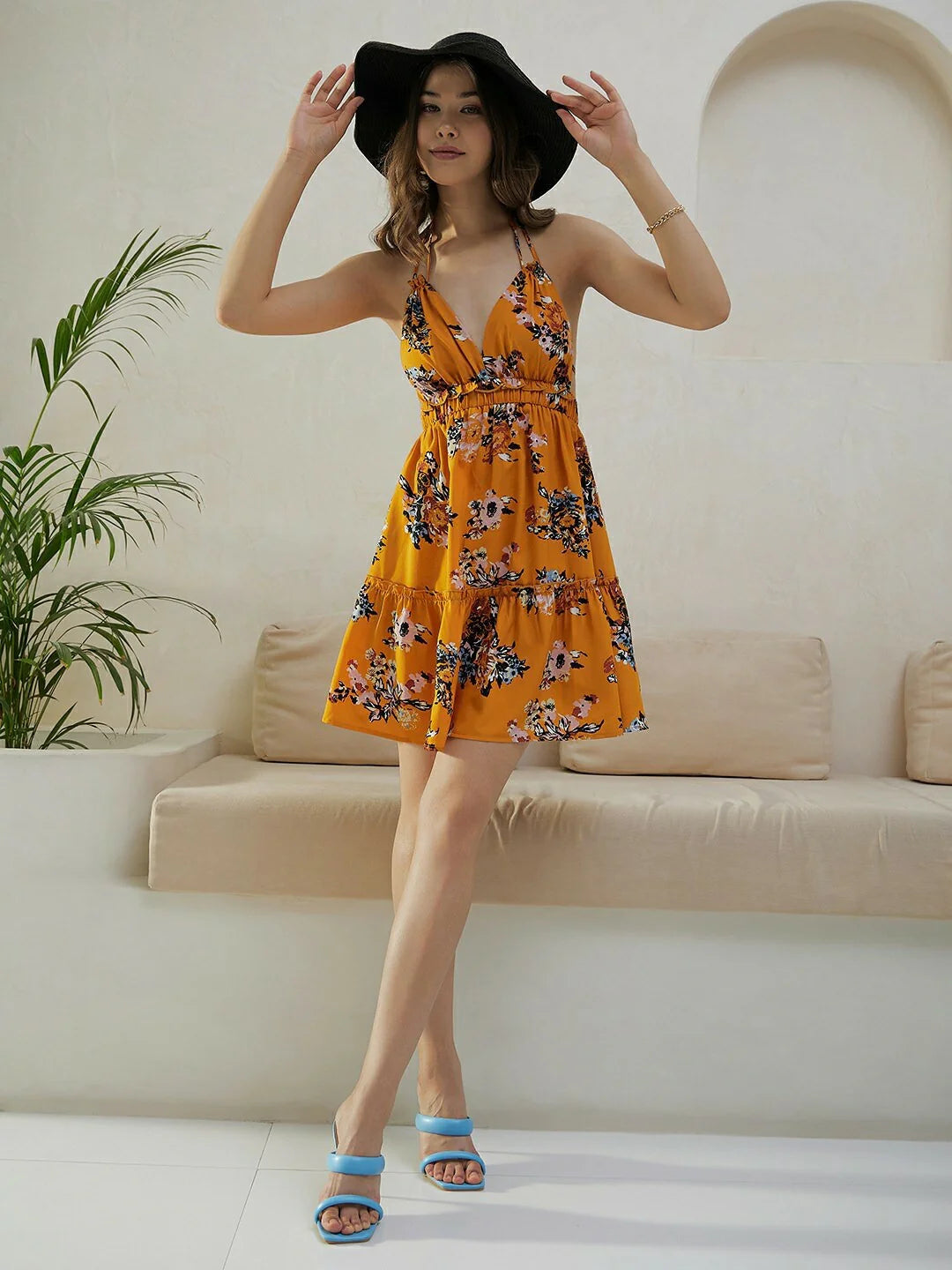 Trendy Mustard Yellow & Blue Floral Printed Sleeveless Mini Dress with Halter Neck, Back Tie-Up, and Flared Fit for Parties