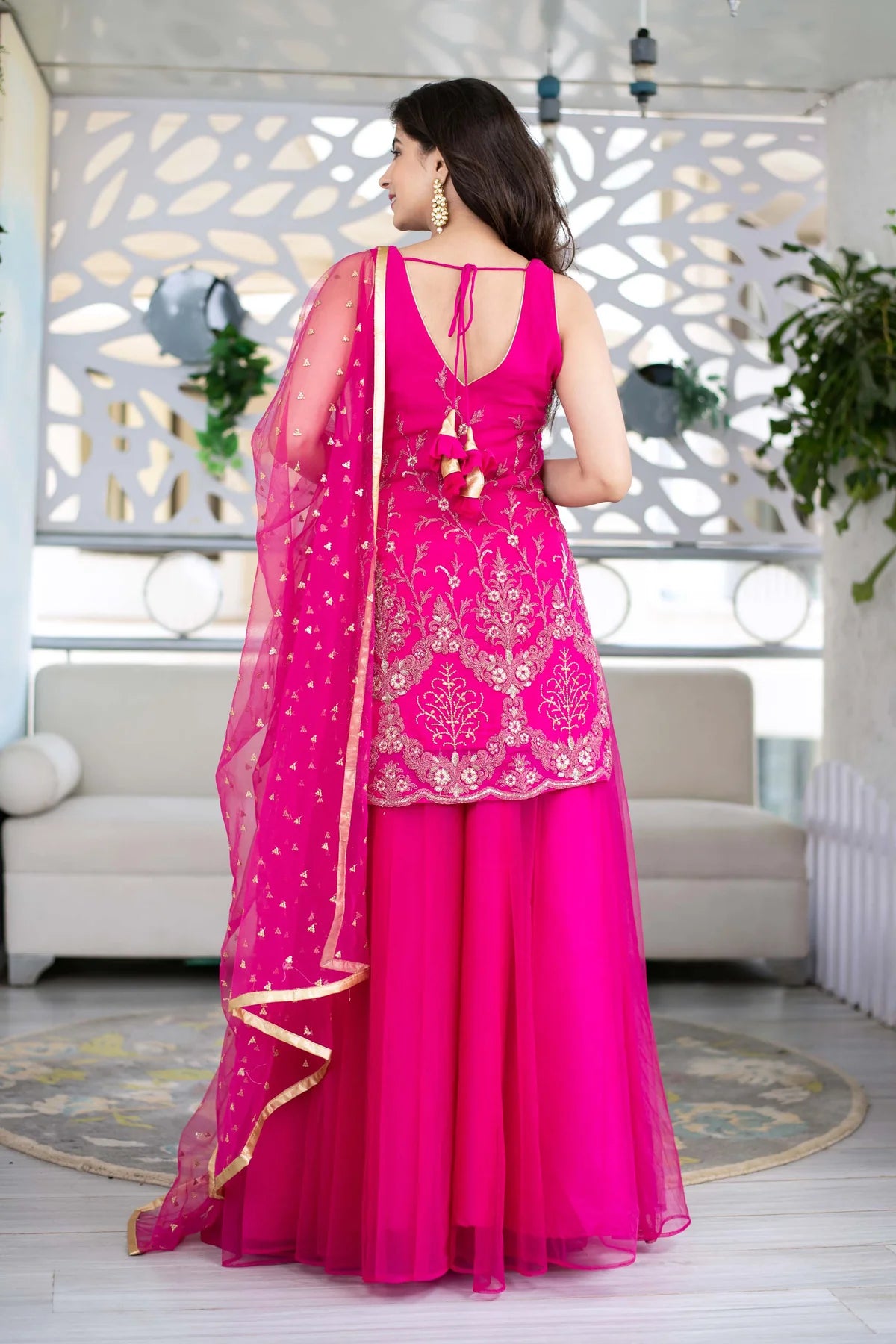 Women Pink Georgette Heavy Work Kurta with Flowing Skirt and Net Dupatta
