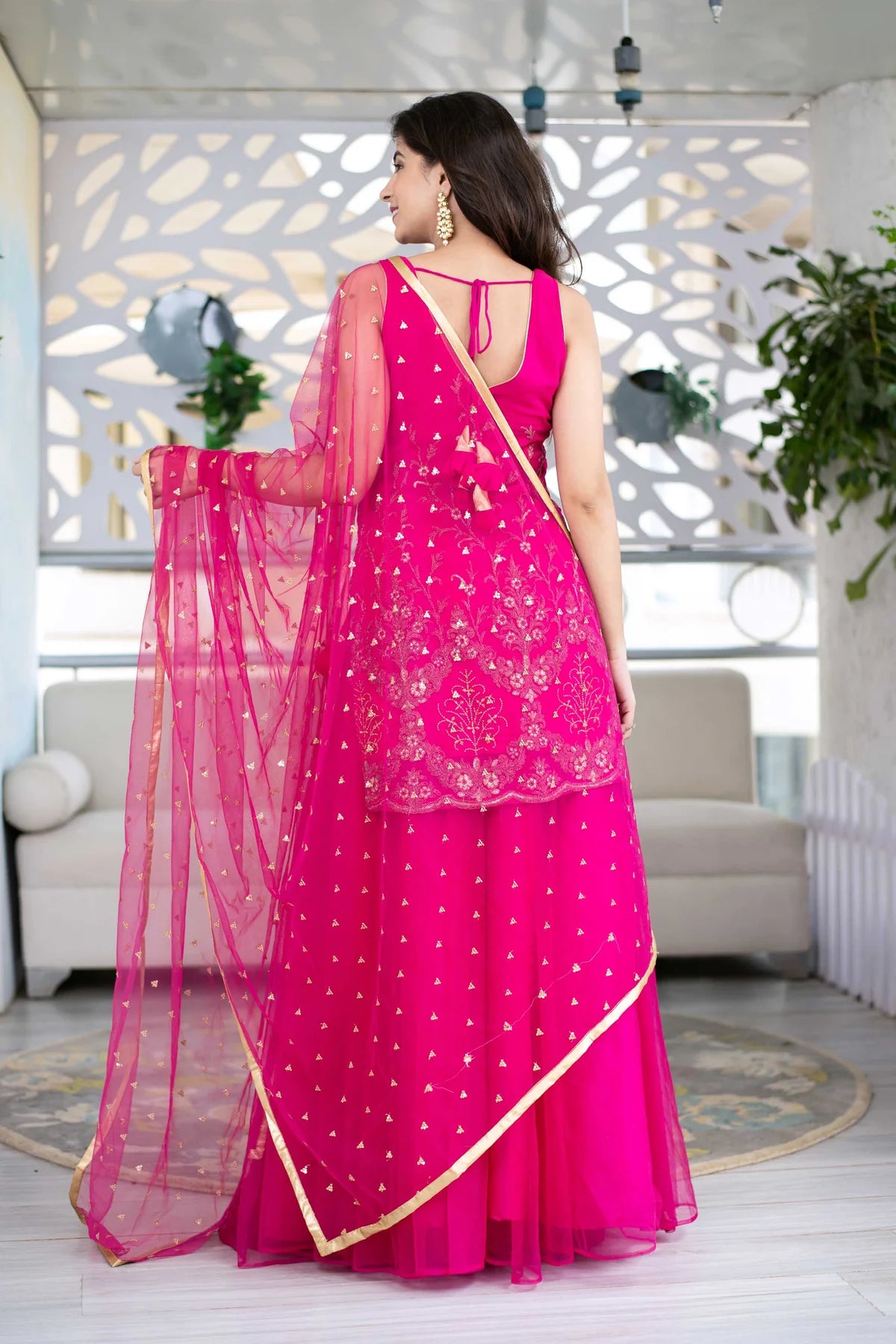 Women Pink Georgette Heavy Work Kurta with Flowing Skirt and Net Dupatta